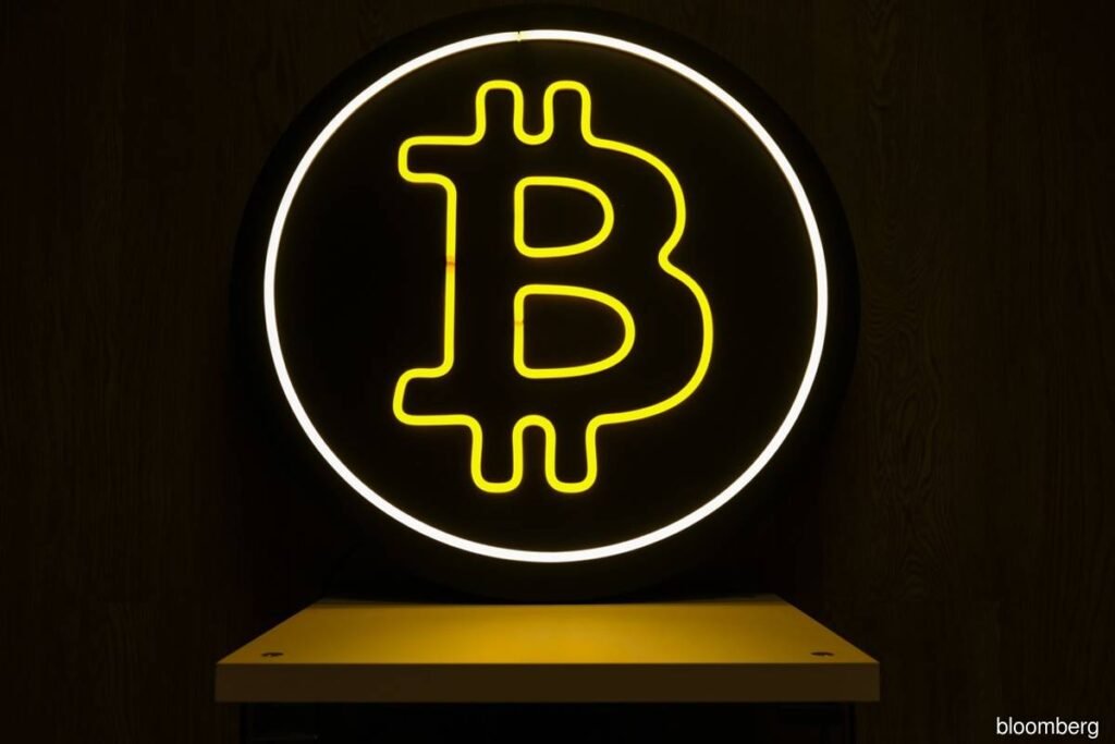 Bitcoin rides debasement trade to three