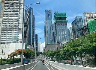 High-rises under construction in Manila. Colliers has described Metro Manila's condominium market as a buyer's market, with more than 32,300 unsold ready-for-occupancy (RFO) units as of Q2 2026. Developers are reportedly using promotions, extended payment terms and rent-to-own schemes to stimulate mid-income demand.