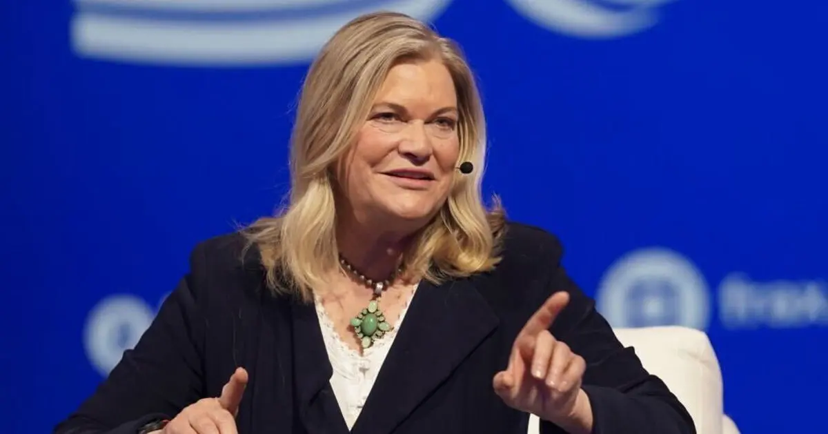 Senator Cynthia Lummis speaking while wearing a dark blazer and a turquoise necklace against a blue background